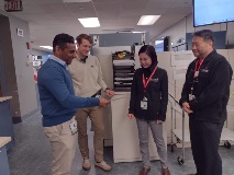 Sachie Dr Oh Vinay Karl standing in the lab
